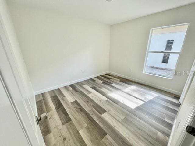 empty room featuring hardwood / wood-style floors