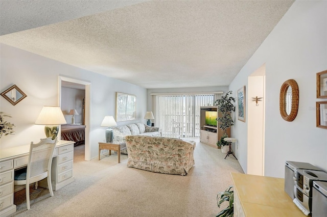 carpeted living room with a textured ceiling and lofted ceiling