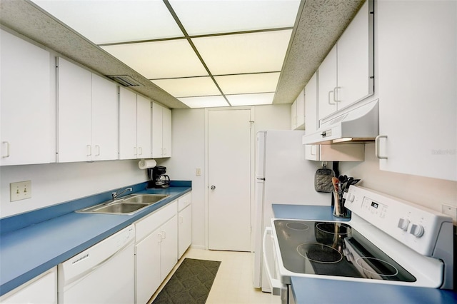 kitchen with white cabinets, light tile flooring, white appliances, and sink