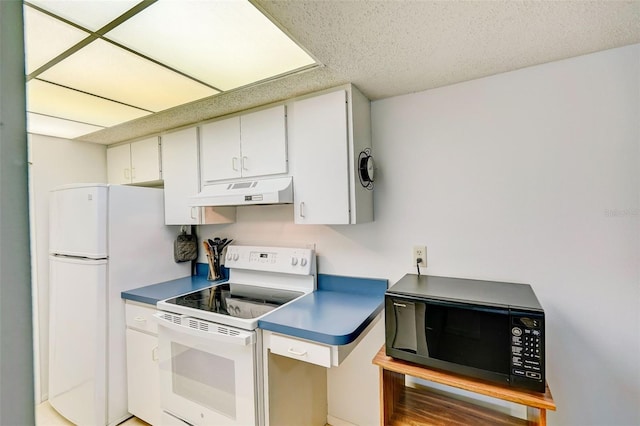 kitchen featuring custom range hood, a textured ceiling, white appliances, and white cabinets