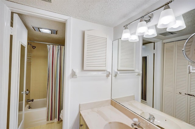 full bathroom featuring shower / bathtub combination with curtain, toilet, a textured ceiling, vanity, and tile floors