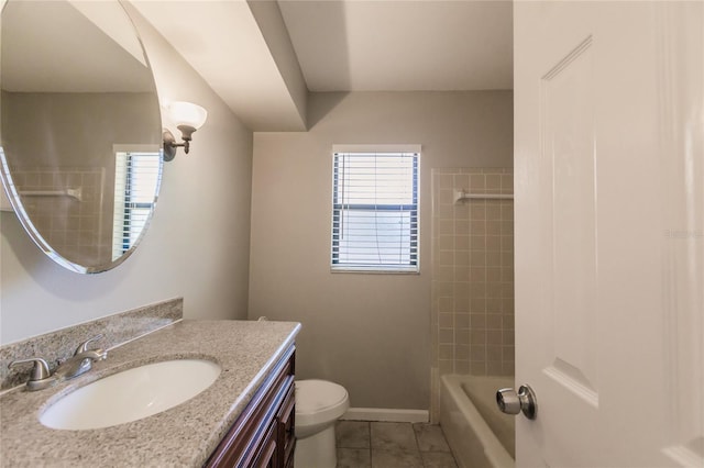 full bathroom featuring tile floors, tiled shower / bath, toilet, and large vanity