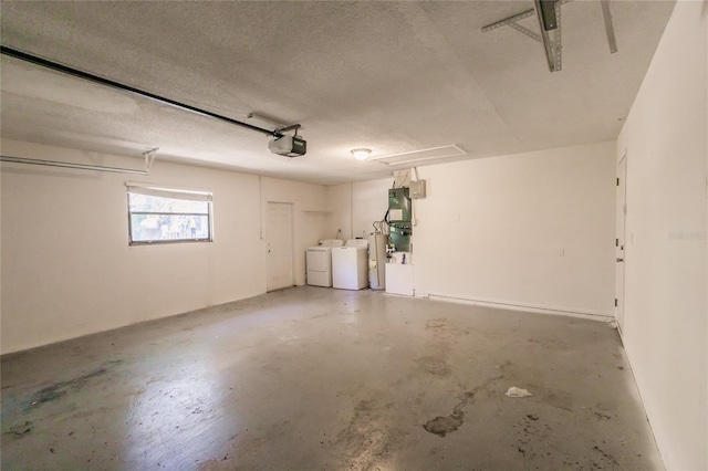 garage with washer and clothes dryer and a garage door opener