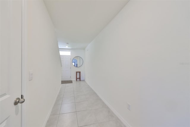 hall with light tile patterned flooring