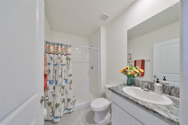 bathroom featuring tile patterned flooring, toilet, vanity, and a shower with shower curtain