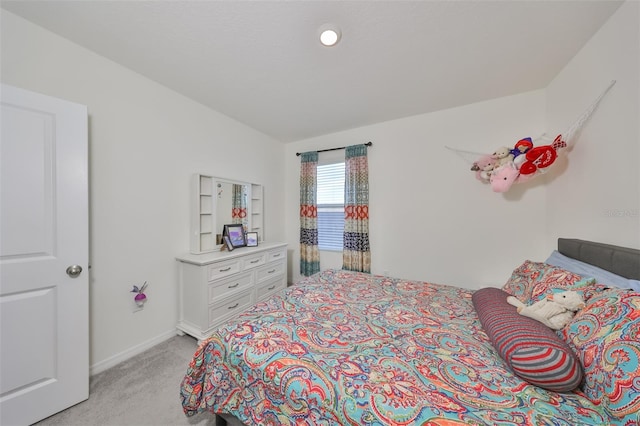 carpeted bedroom featuring vaulted ceiling