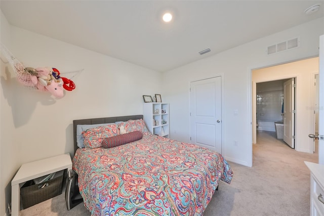 bedroom featuring light carpet