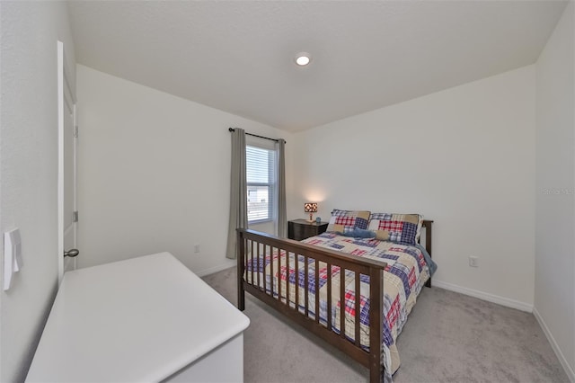 bedroom featuring light colored carpet