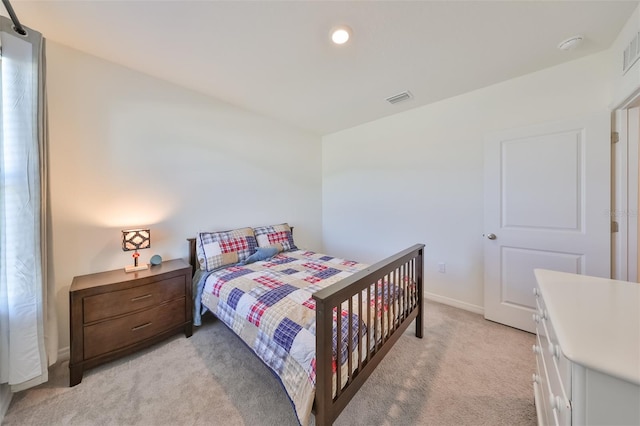 bedroom with light colored carpet