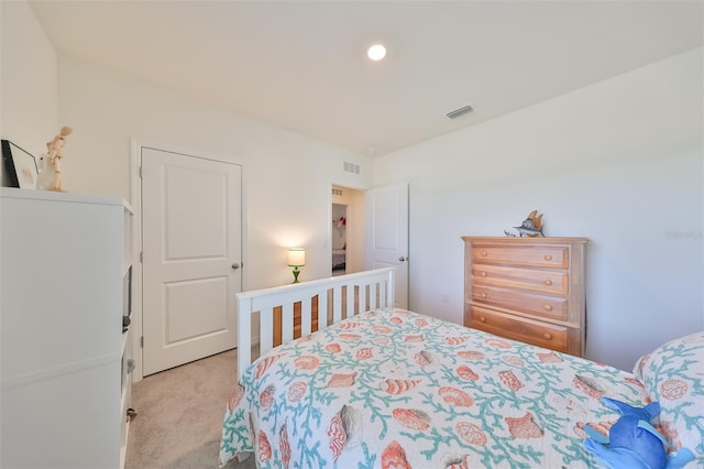 bedroom featuring light carpet