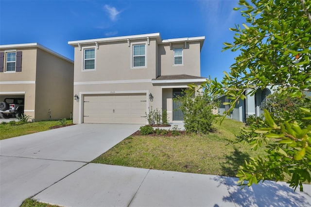 view of front of property with a garage and a front lawn