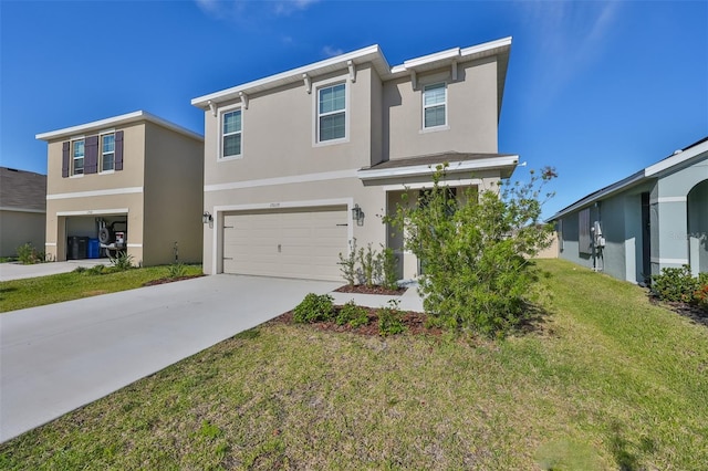 view of front of home featuring a garage and a front yard