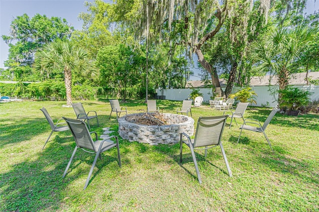 view of yard with an outdoor fire pit