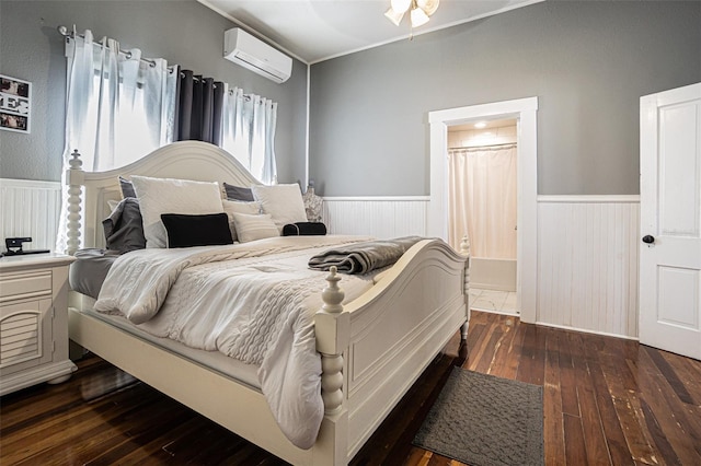 bedroom with a wall unit AC, ceiling fan, and dark hardwood / wood-style flooring