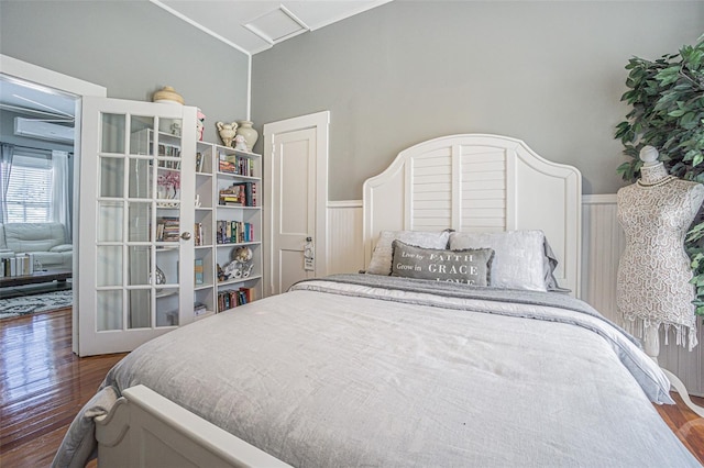 bedroom with dark wood-type flooring