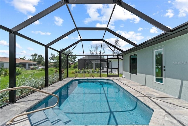 view of pool featuring a lanai and a patio