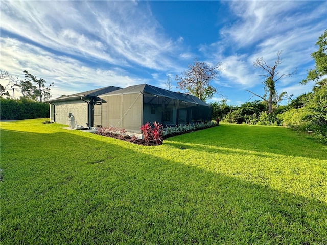 view of yard featuring glass enclosure