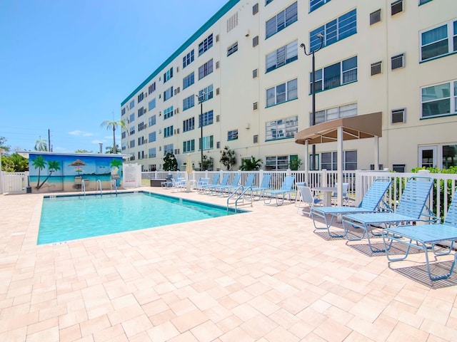 view of swimming pool with a patio