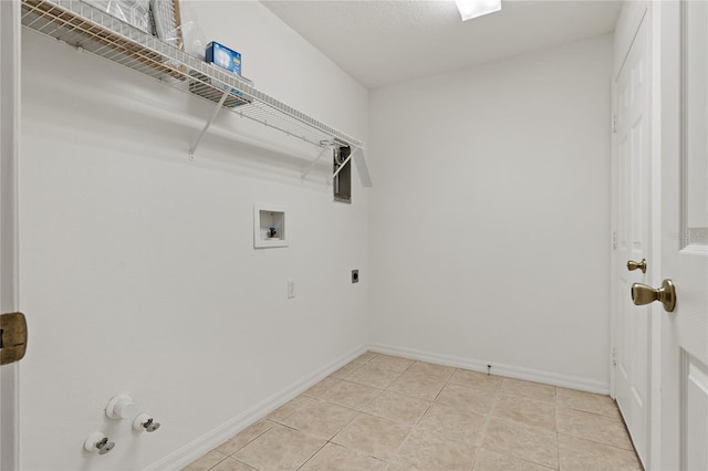 laundry room featuring gas dryer hookup, electric dryer hookup, washer hookup, and light tile patterned floors