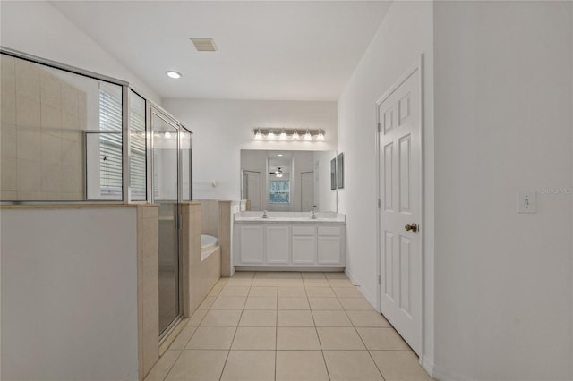 bathroom with vanity, shower with separate bathtub, and tile patterned flooring