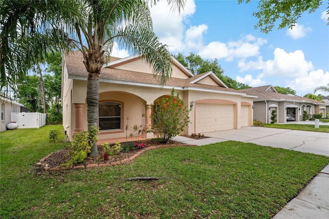 view of front of home featuring a garage and a front lawn