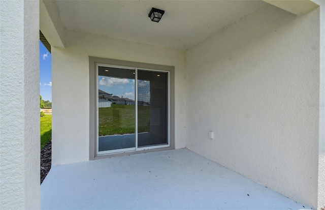 doorway to property featuring a patio