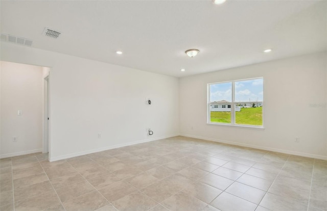 empty room with light tile patterned floors