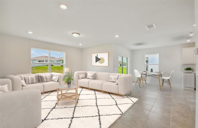 living room with light tile patterned floors