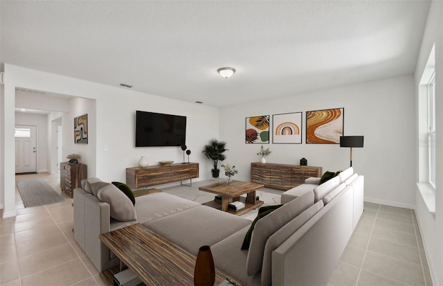 tiled living room with a healthy amount of sunlight