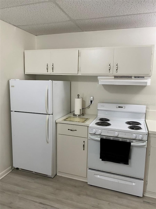 kitchen with light hardwood / wood-style floors, white appliances, a drop ceiling, and white cabinetry