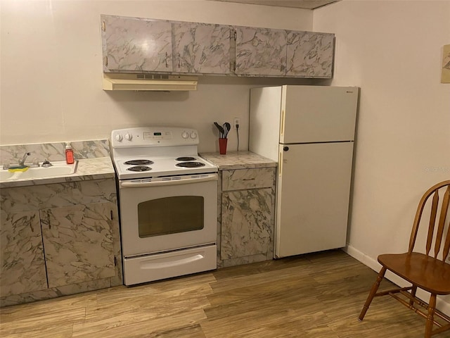 kitchen featuring sink, white appliances, light hardwood / wood-style floors, and custom exhaust hood