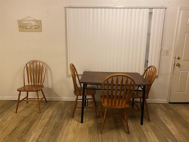 dining space featuring hardwood / wood-style floors