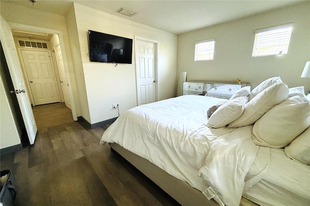 bedroom featuring dark hardwood / wood-style flooring