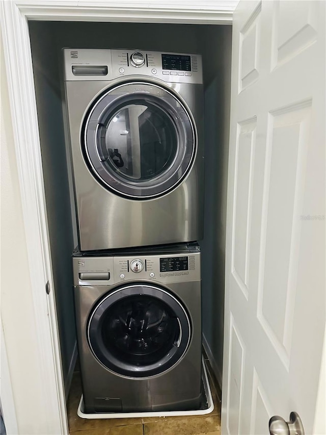 clothes washing area with stacked washer / drying machine