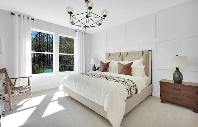 carpeted bedroom with a chandelier