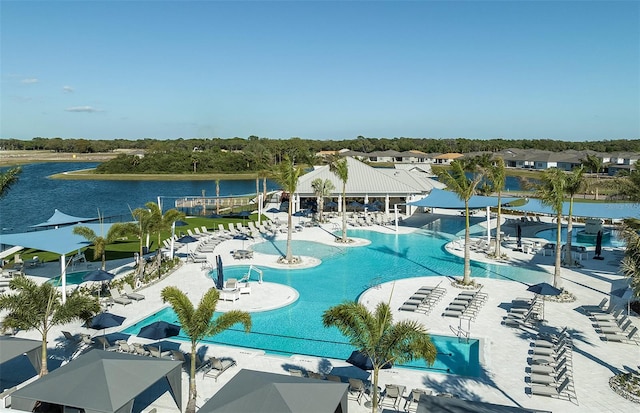 view of swimming pool featuring a water view