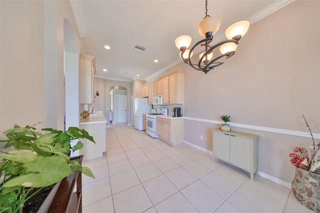 kitchen with arched walkways, white appliances, visible vents, light countertops, and light brown cabinetry