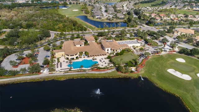 bird's eye view with a residential view, view of golf course, and a water view