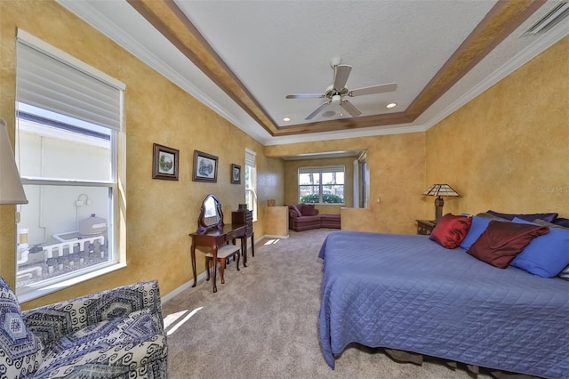 bedroom featuring carpet floors, crown molding, visible vents, a ceiling fan, and baseboards