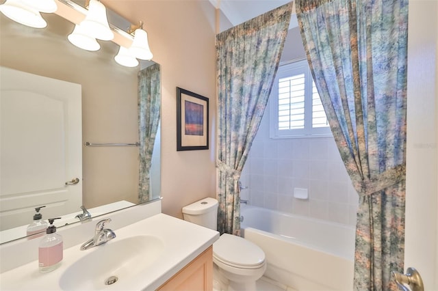 full bath with toilet, shower / bath combo with shower curtain, and vanity