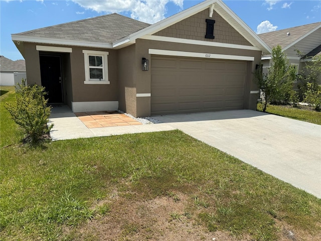 view of front facade with a garage and a front yard