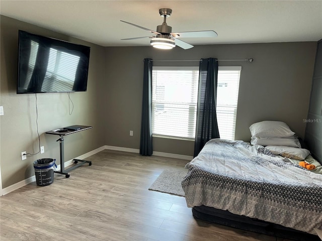 bedroom featuring ceiling fan and light wood-type flooring