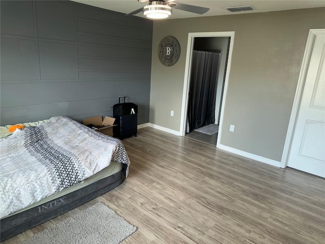 bedroom featuring ceiling fan and hardwood / wood-style flooring