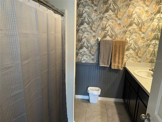 bathroom featuring tile flooring and vanity