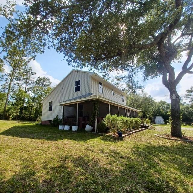 back of house with a yard