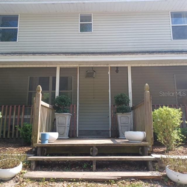 entrance to property with covered porch