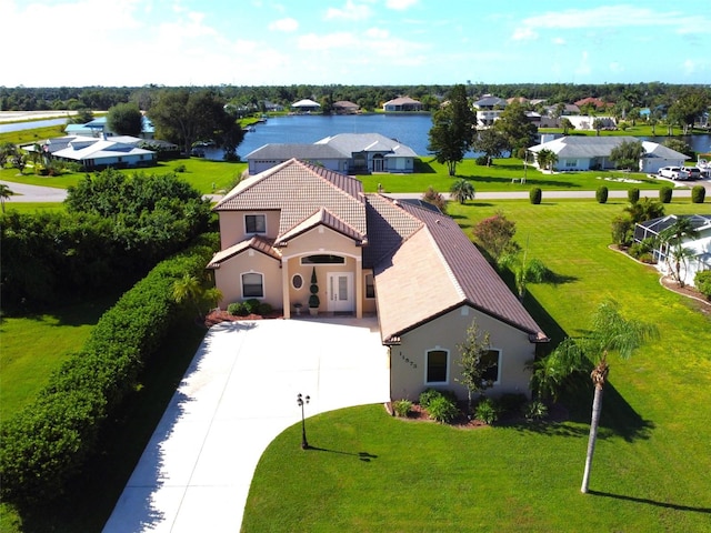 birds eye view of property with a water view