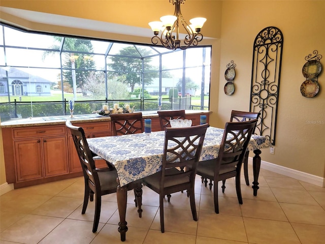 tiled dining area with a notable chandelier and sink