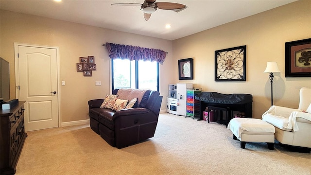 carpeted living room featuring ceiling fan