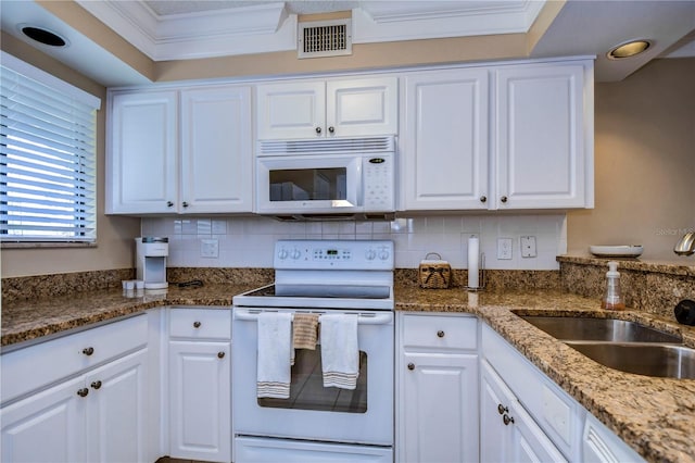 kitchen featuring ornamental molding, white cabinets, white appliances, and backsplash